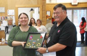 Daughter accepts late father’s military service medals