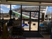 Wind topples store awning Monday