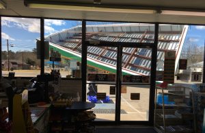 Wind topples store awning Monday
