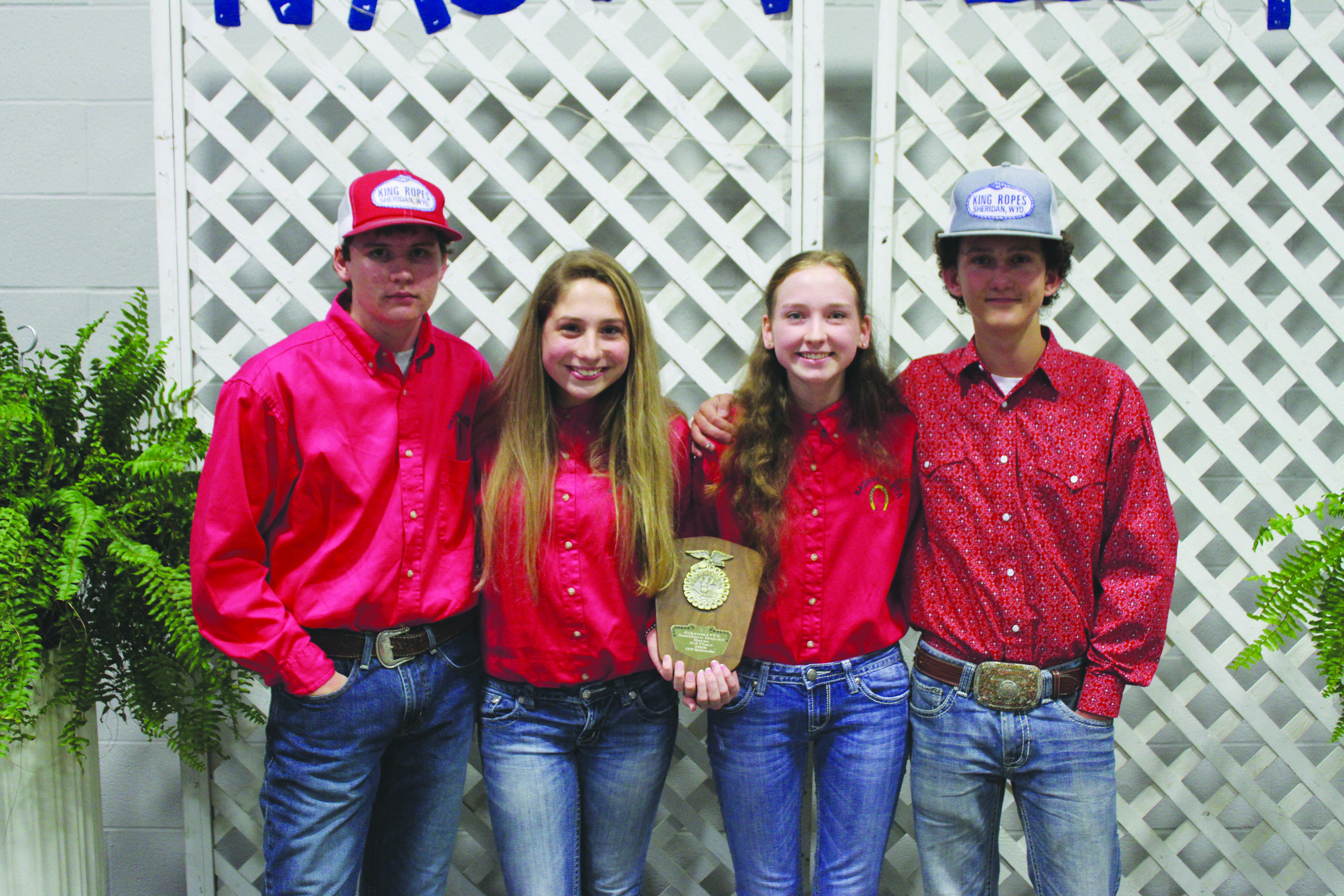The Nashville FFA Horse Judging Team made up of Trevor Harris, Bravyn Bell, Hannah Barfield and Scotty Clay stand with there third place district trophy. The team is a new addition to the Nashville chapter of the FFA and has already competed at the state level in their first season.