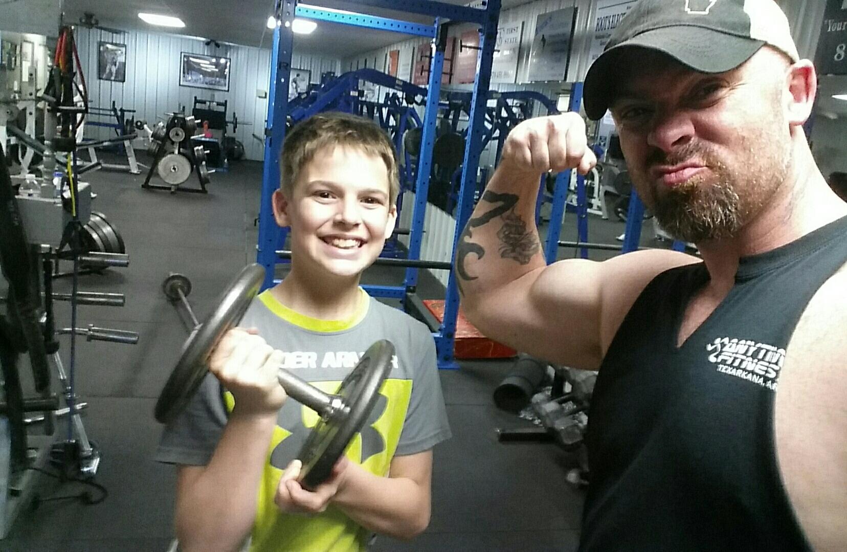 Brandon Pope is a survivalist and a self-admitted "fitness nut" who dedicates his free time to lifting weights and spending time with his children - Jayden and Journey - teaching them survival skills, Bushcraft, and enjoying the outdoors. He is pictured with his son, Jayden, 13, after a workout session at Flex Gym in Nashville.
