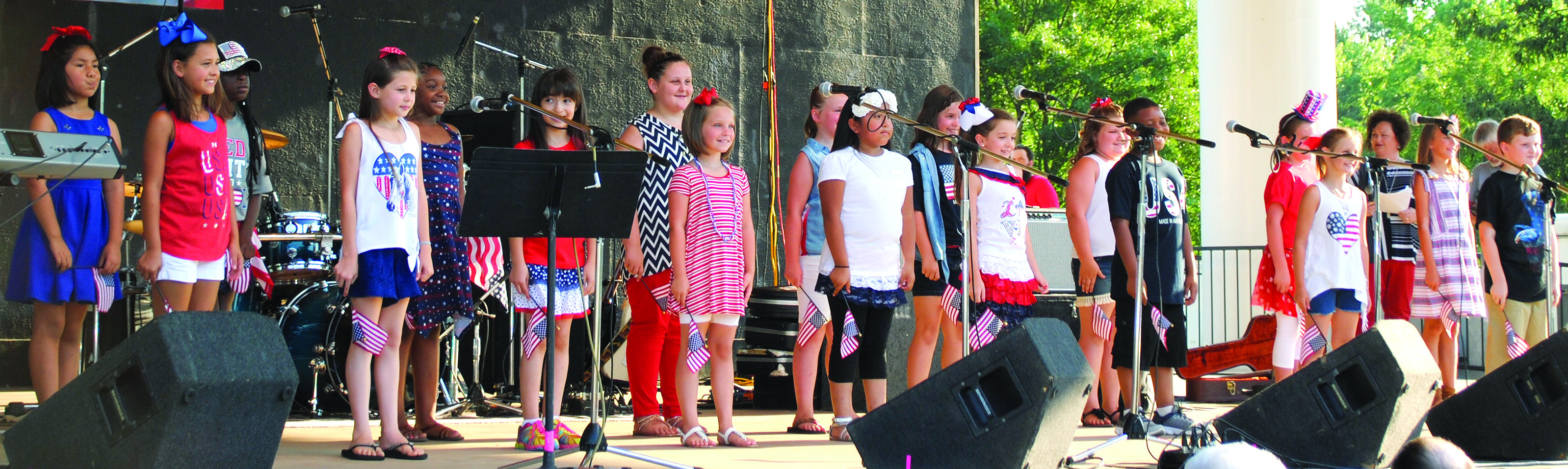 Nashville Primary School students directed by Stacia Petty sing “Battle Cry of Freedom” Saturday during Stand Up for America. The patriotic celebration attracted hundreds to the Nashville City Park.
