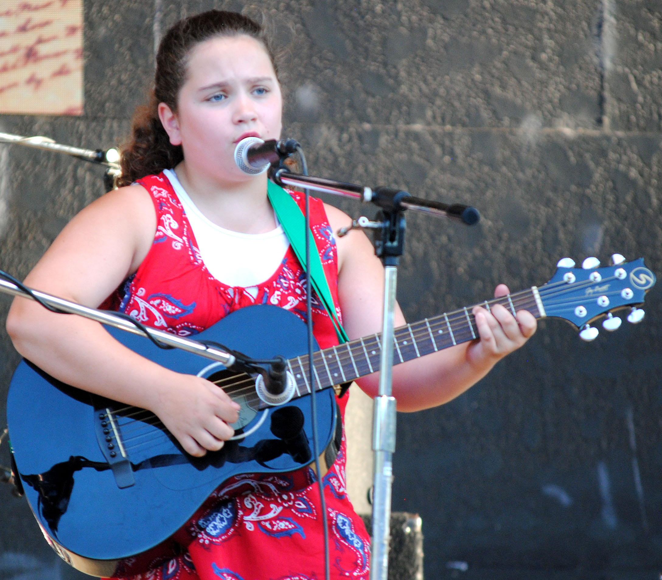 Allie Westbrook sings at the Stand Up for America celebration. 