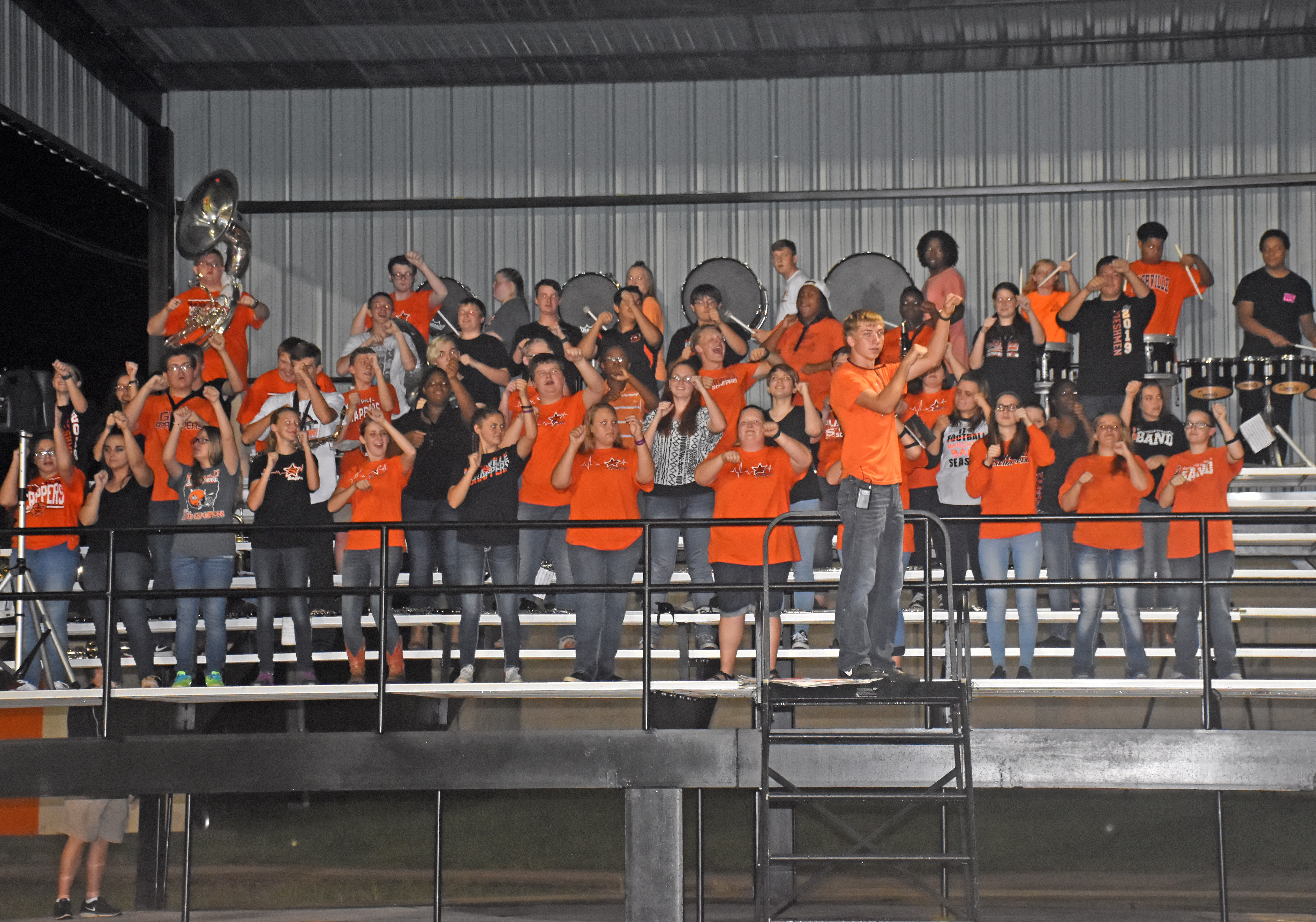 Scrapper band members cheer from the new bandstand Friday night at Scrapper Stadium.