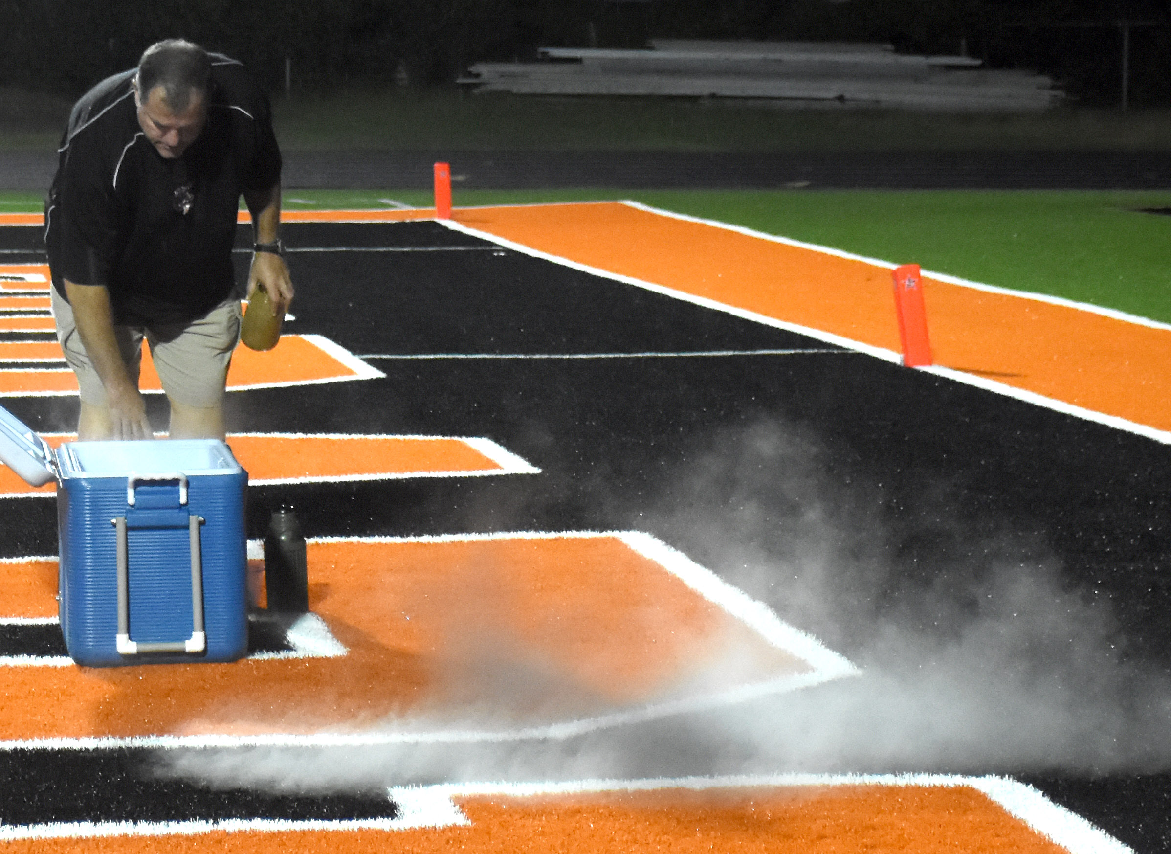 Assistant Superintendent Joe Kell releases Scrapper Spirit into the north endzone of Scrapper Stadium to mark the completion of stadium upgrades after the installation of artificial turf. The endzone has been the site for many key plays for the Scrappers.