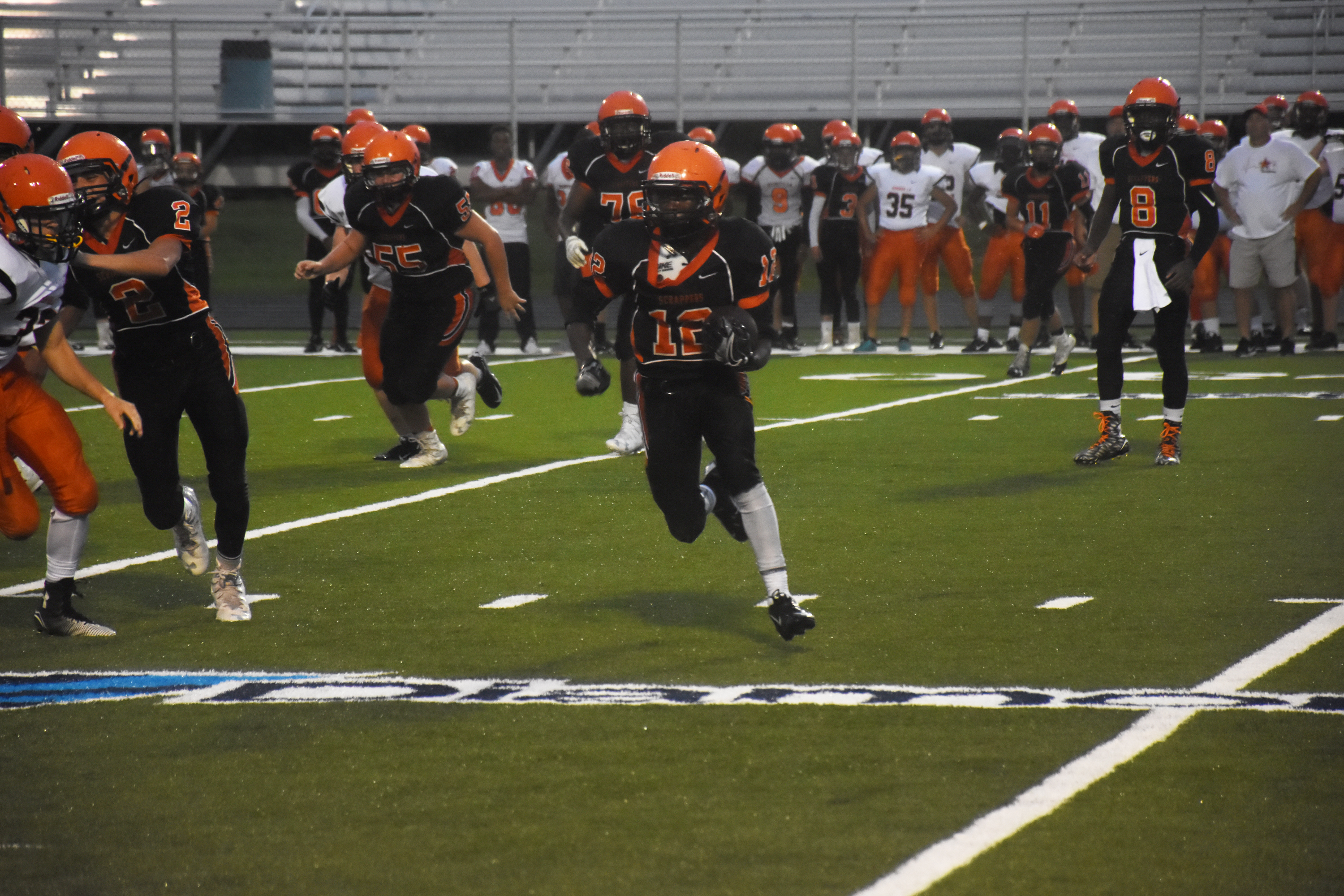 Carmillias Morrison (12) carries the ball for the junior Scrappers in their scrimmage against the sophomore Scrappers Aug. 19. Morrison is expected to see extensive duty at running back for the juniors. Their season will open Sept. 8 at Magnolia. The first home game will be Sept. 15 against Hope.