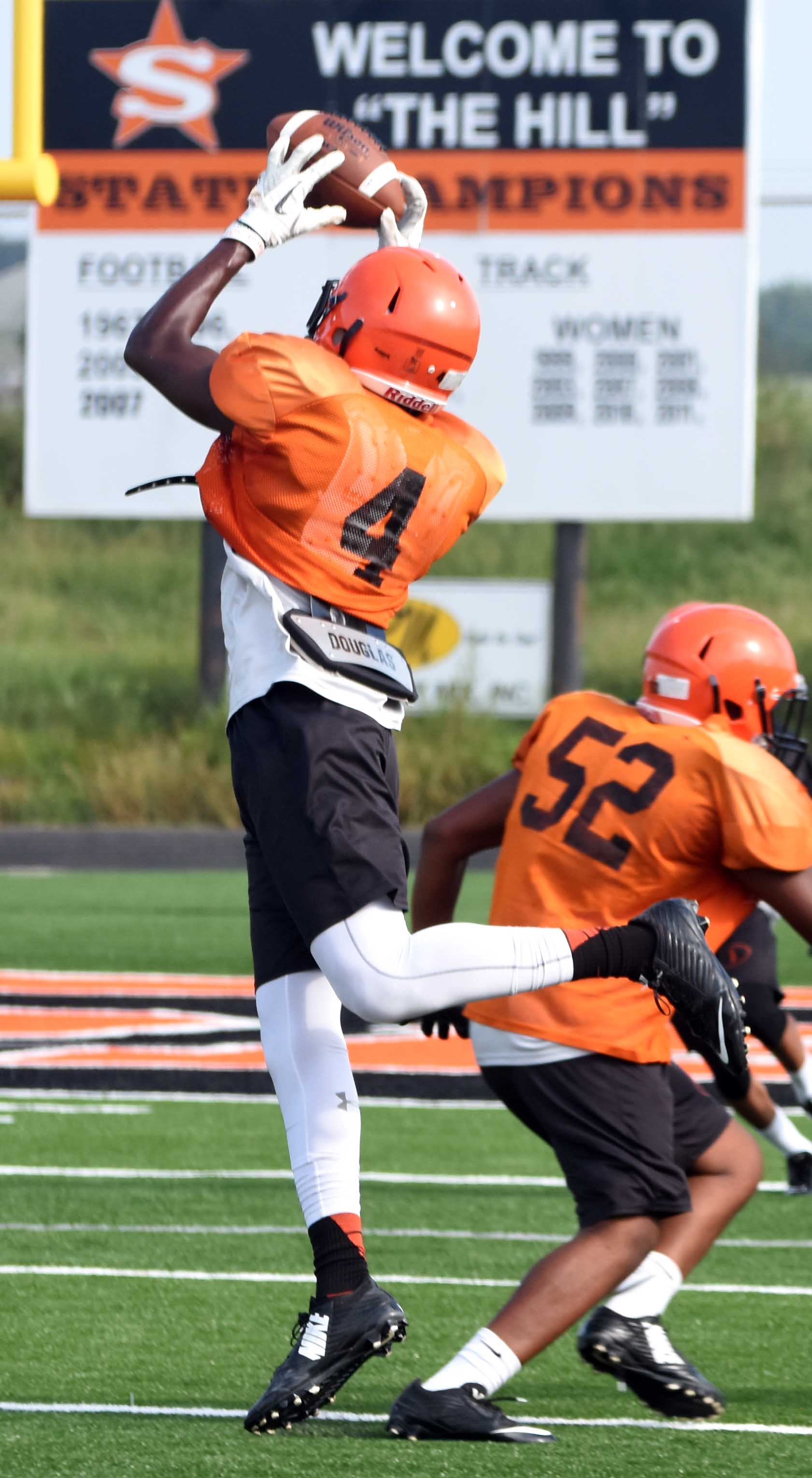 Ty Pettway (4) makes the catch Saturday morning during the scrimmage at Scrapper Stadium.