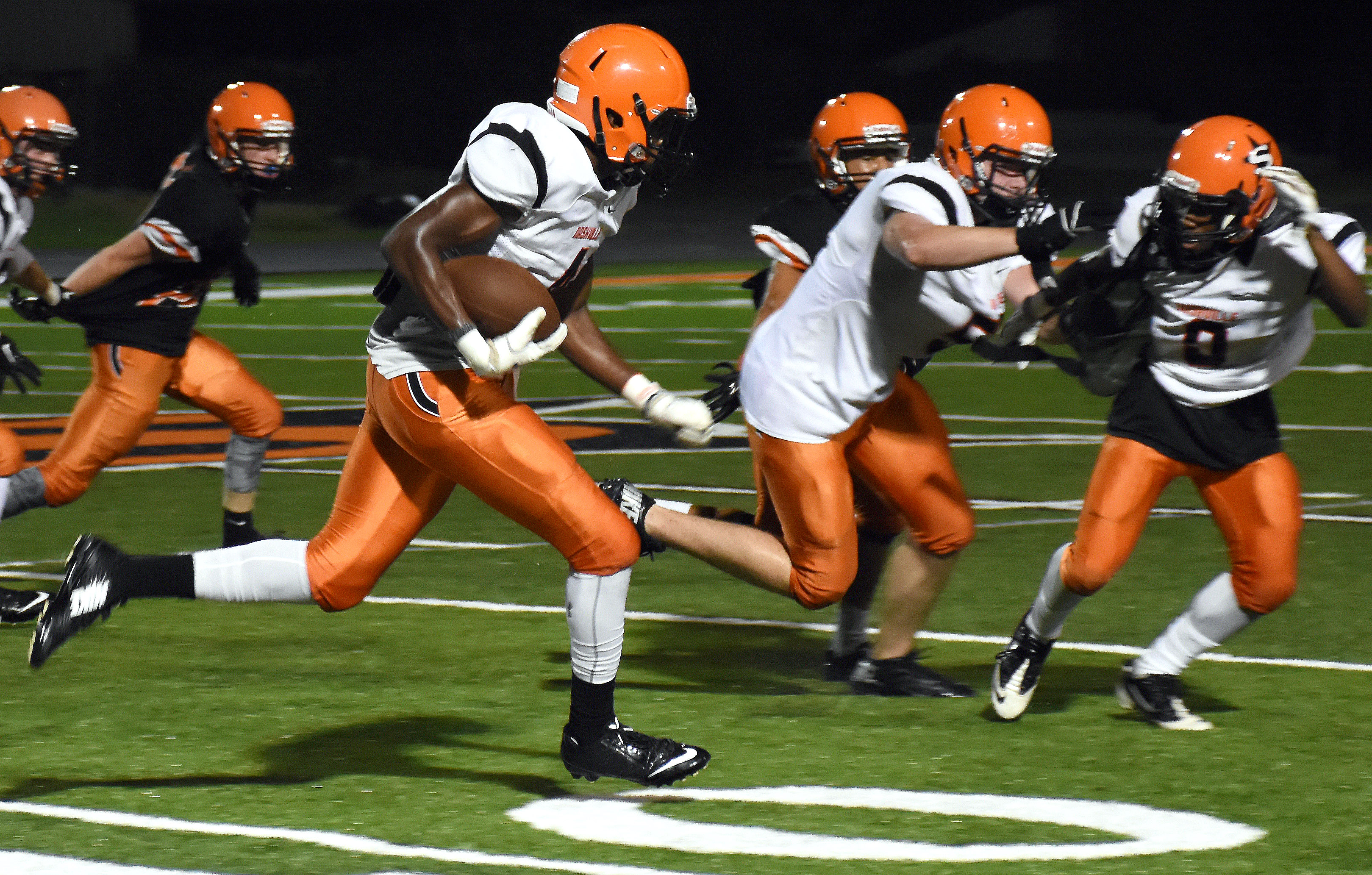 Ty Pettway (4) runs the ball after a pass reception Friday night.