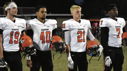 Scrapper team captains Mace Green, Jordan Summers, Dalton Smead and CJ Spencer line up on the field at Ashdown.