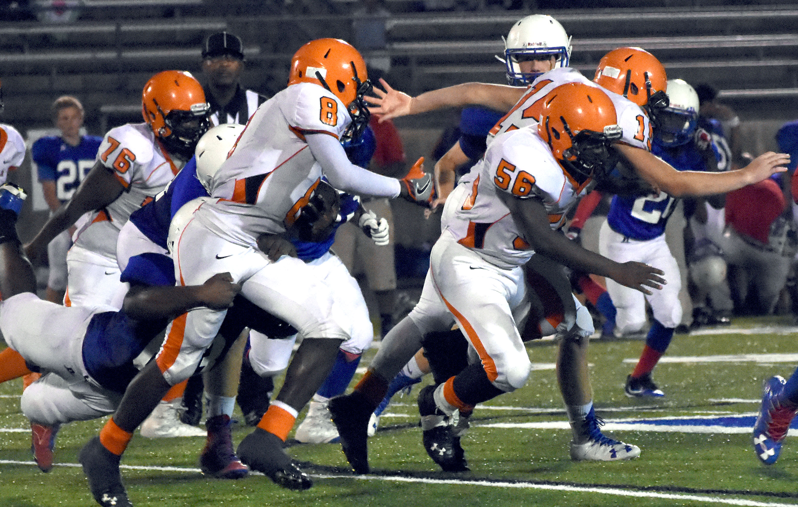 Kendrix Holcom (76), Ty Gordon (15) and Jalonte Gilliam (56) clear the way for Lance Easter (8) Nov. 3 in the Nashville Junior Scrappers 27-8 win at Arkadelphia.