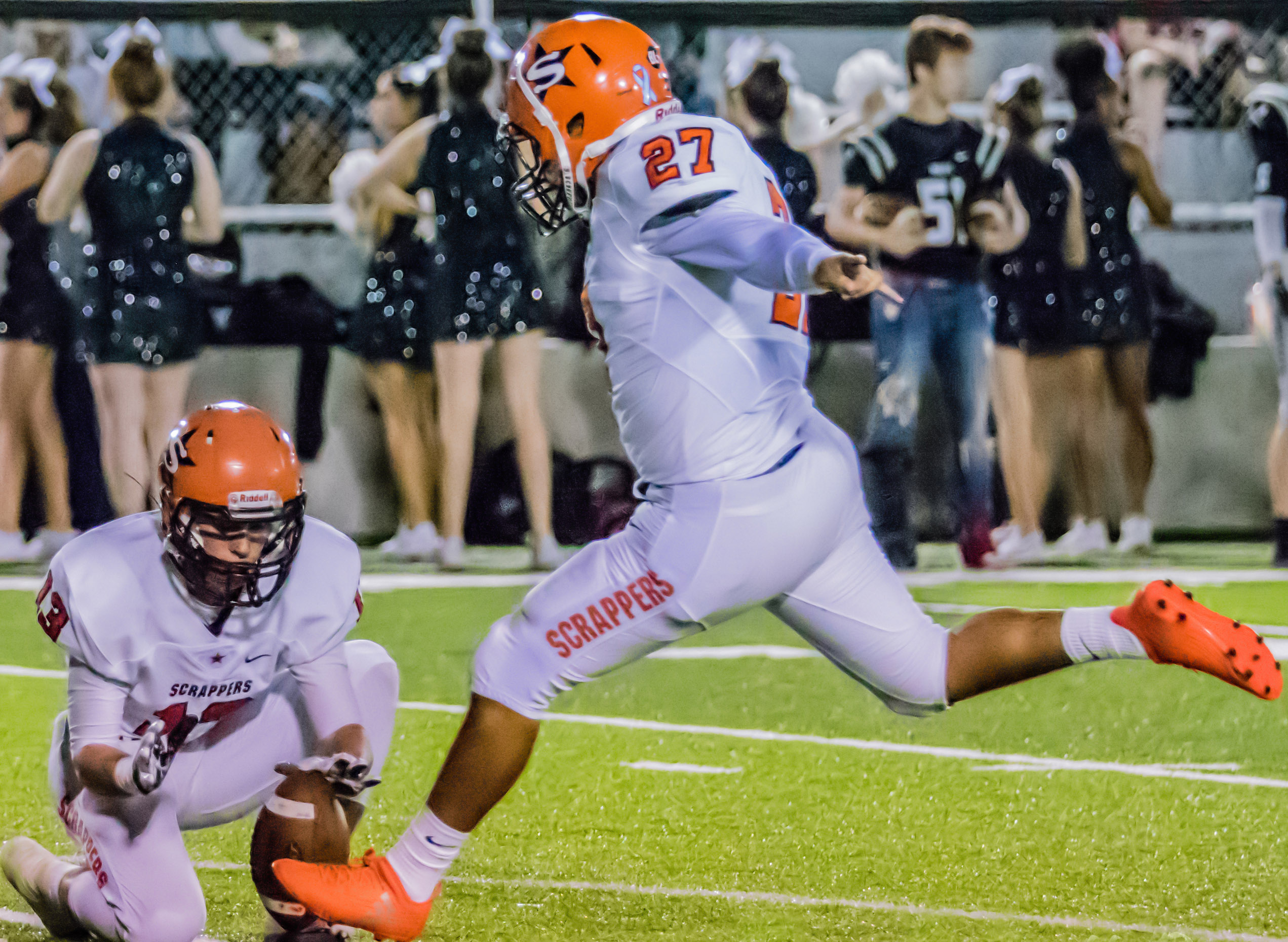 Jose Hernandez (27) kicks the PAT for the Scrappers as Zach Jamison holds. Hernandez made 7 of 7 extra point attempts in the regular season finale at Bauxite.