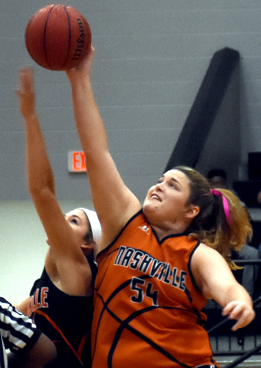Madi Miller and Alyssa Harrison vie for the tip at the Orange and Black Scrimmage.