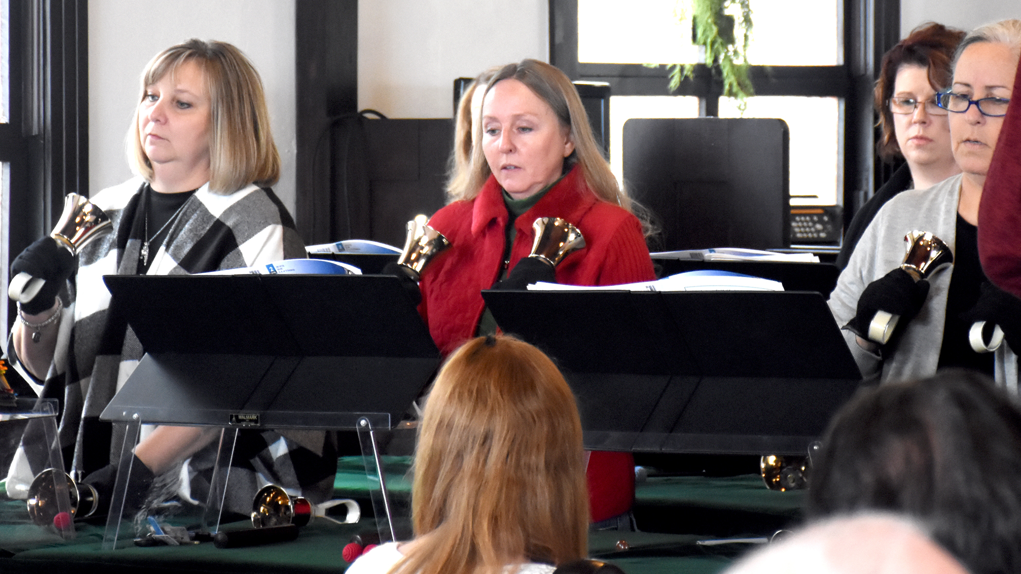 Members of the Agape Handbell Choir from First United Methodist Church present "We Three Kings" Sunday afternoon at the Hometown Christmas program at the Howard County museum in Nashville.