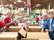 Christmas Child volunteers work at processing center