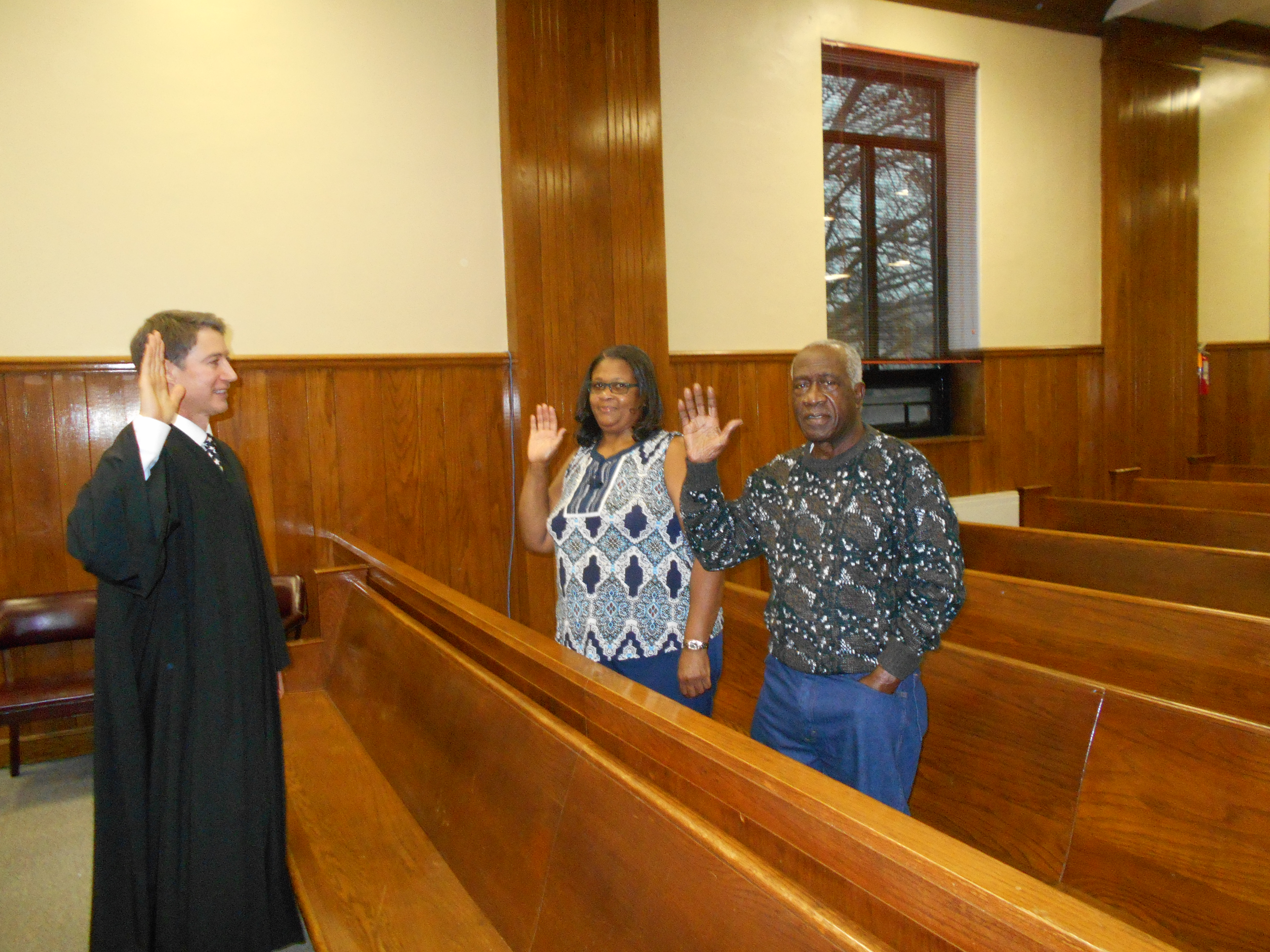 Judge Tom Cooper administers the oath of office to two veteran Tollette council members , Brenda Porter, and James Porter. The latter has served on the Tollette council for 35 years, dating back to the incorporation of the city. 