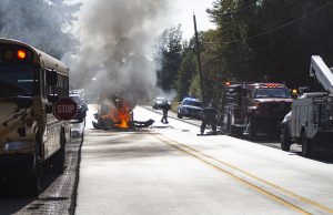 Mustang rear-ends school bus, ignites