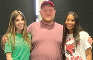 Four NHS students sign college letters